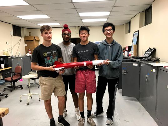 Group pic with the rocket.