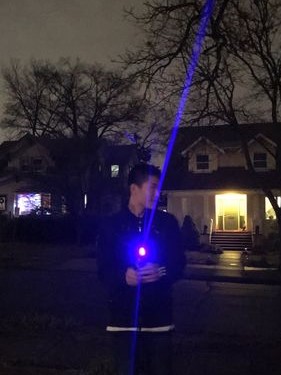 Holding the lightsaber.