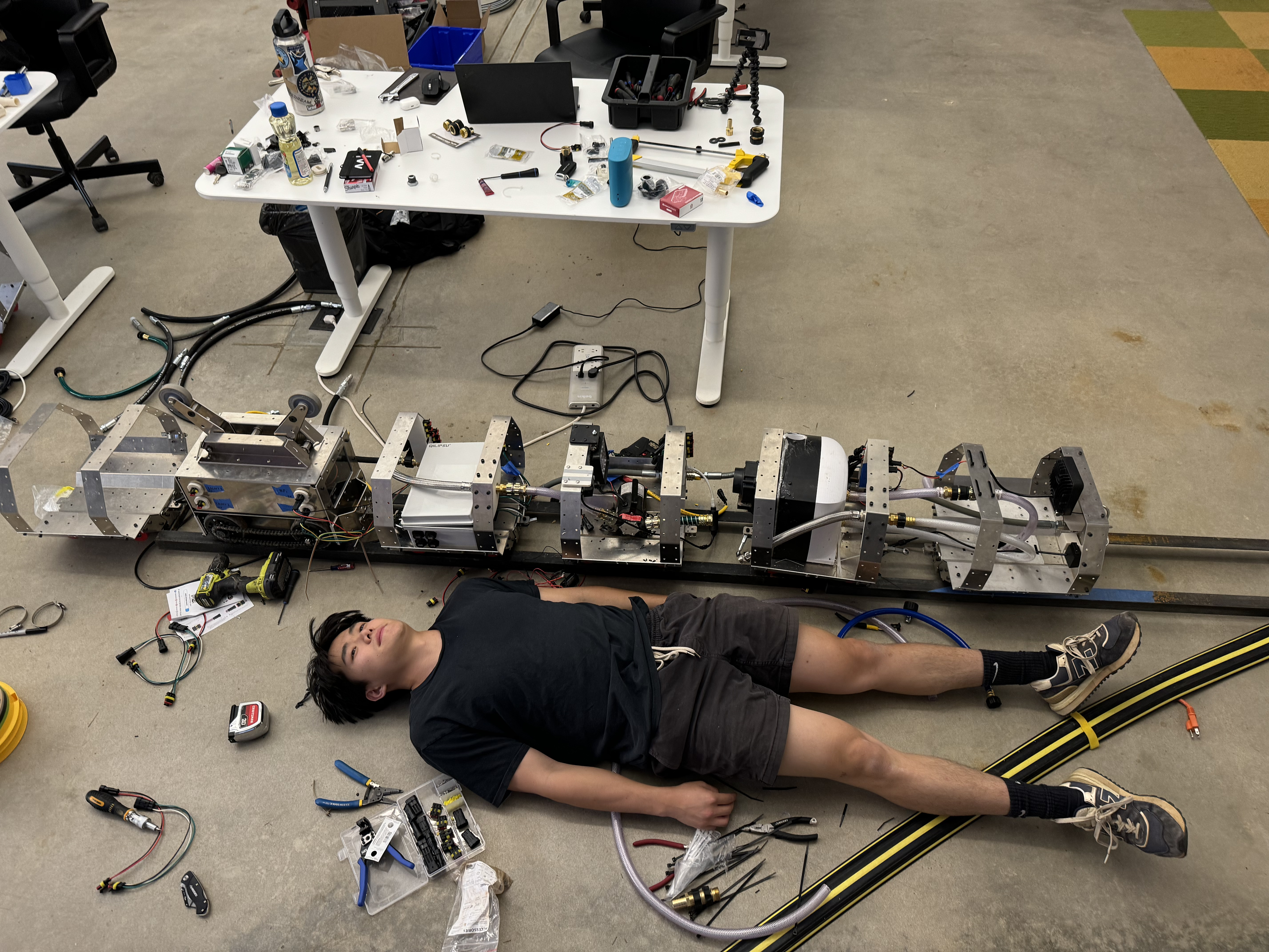 Me laying down next to robot